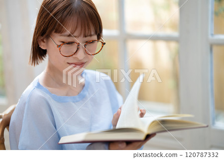 A young woman reading A young woman reading 120787332