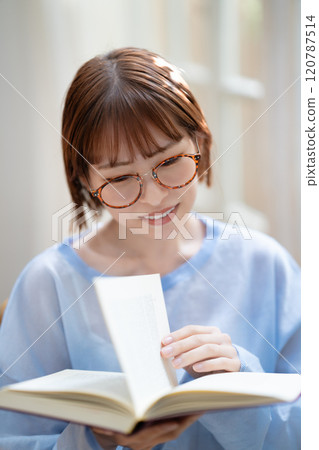 A young woman reading A young woman reading 120787514