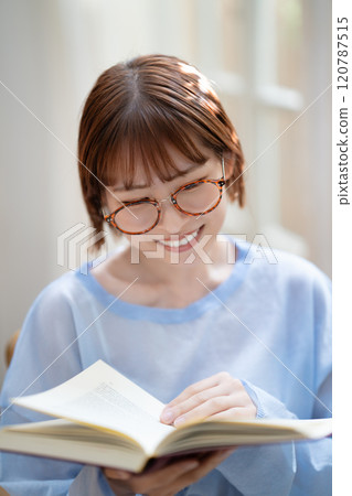 A young woman reading A young woman reading 120787515
