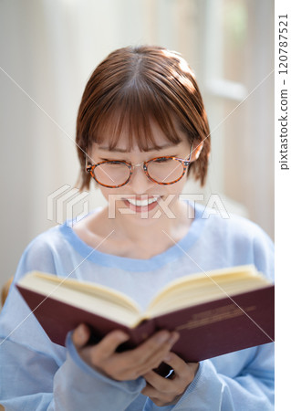 A young woman reading A young woman reading 120787521