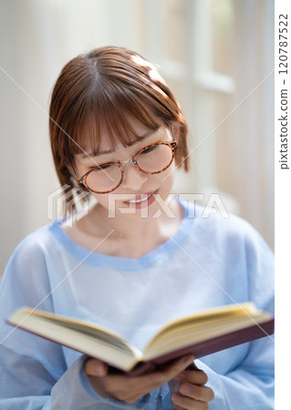 A young woman reading A young woman reading 120787522