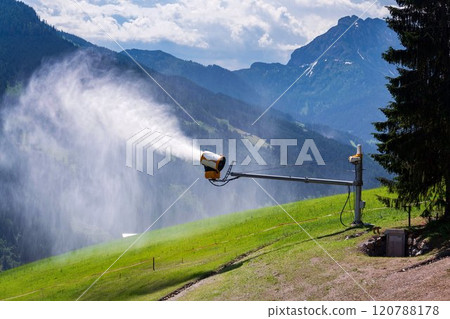 Snow making machines on slope on sunny day, snow cannon, snow gun 120788178