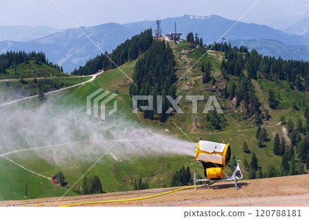 Snow making machines on slope on sunny day, snow cannon, snow gun 120788181