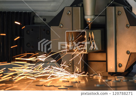 Close up scene the fiber laser cutting machine cut the stainless steel square tube and sparkling light. 120788271