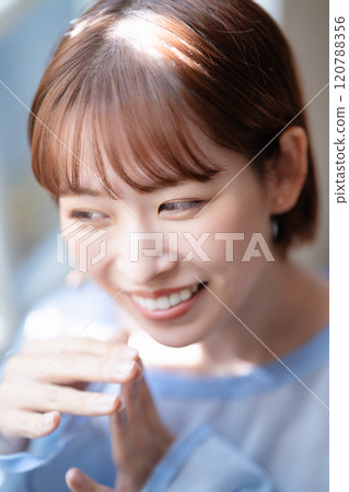 A young woman with a feminine short bob 120788356