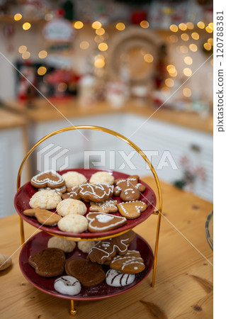 Christmas cookies and Interior decorated kitchen with Christmas decor on background. Christmas in kitchen table setting. 120788381