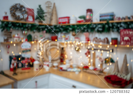 Blurred christmas kitchen, golden bokeh.Christmas background. Merry Christmas and Happy New Year Blurred christmas kitchen, golden bokeh.Christmas background. Merry Christmas and Happy New Year 120788382