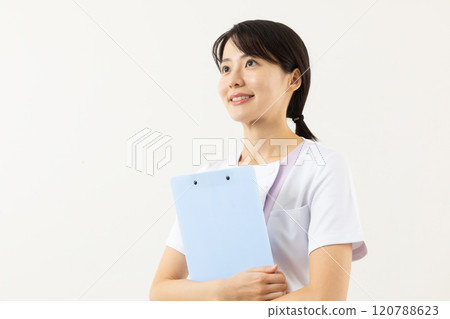 Nurse holding a binder 01 Nurse holding a binder 01 120788623