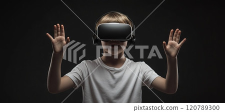Little boy wearing VR glasses with his hands virtual reality gadget in futuristic room 120789300