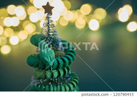 Chinese New Year. A vibrant green snake intertwined on christmas tree Chinese New Year. A vibrant green snake intertwined on christmas tree 120790455