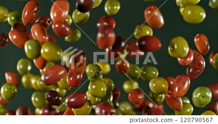 Freeze Motion of Flying Black and Green Olives. 120790567
