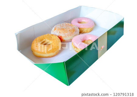 Sweet donuts in a box on a white table. Sweet donuts in a box on a white table. 120791318