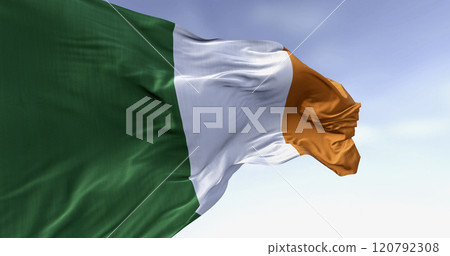 Ireland national flag waving in the wind on a clear day Ireland national flag waving in the wind on a clear day 120792308
