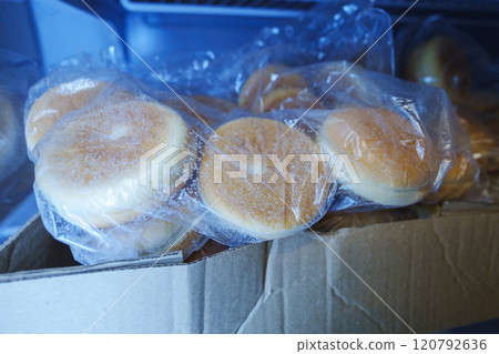 Frozen hamburger buns in the fridge. Selective focus Frozen hamburger buns in the fridge. Selective focus 120792636