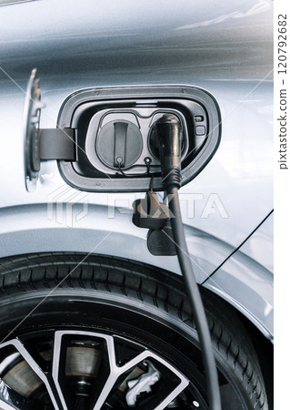 Charging an electric car. Modern electric car 120792682