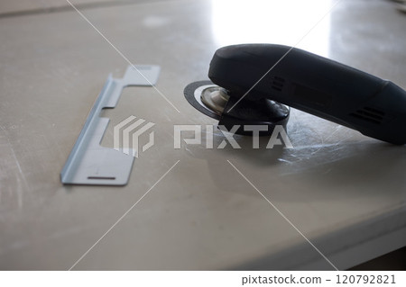 Deburring work with grinder Deburring work with grinder 120792821