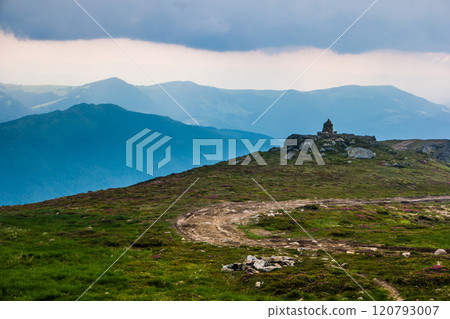 Mountain path on the blue sky background Mountain path on the blue sky background 120793007
