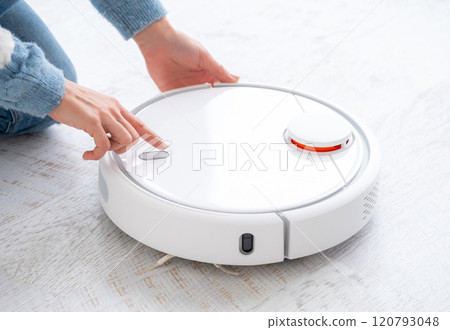 Switching on robotic vacuum cleaner 120793048