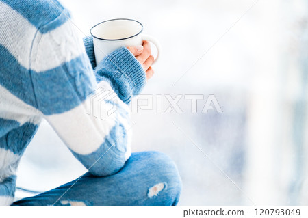 Resting with cup of tea 120793049