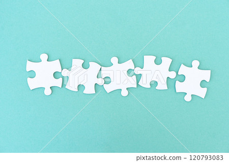 Jigsaw puzzle pieces in row 120793083