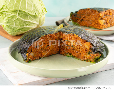 Chou farci, stuffed savoy cabbage pie with lentil quinoa ragu Chou farci, stuffed savoy cabbage pie with lentil quinoa ragu 120793700