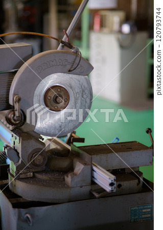 Cutting aluminum frame with metal saw 120793744