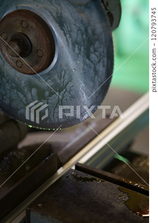 Cutting aluminum frame with metal saw Cutting aluminum frame with metal saw 120793745