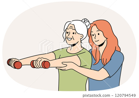 Elderly woman trains with physiotherapist and lifts dumbbells to stay healthy after retirement 120794549