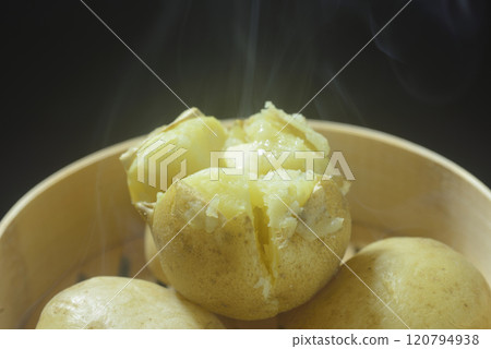 Steaming buttered potatoes Steaming buttered potatoes 120794938