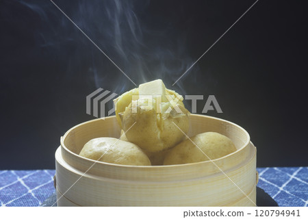 Steaming buttered potatoes 120794941