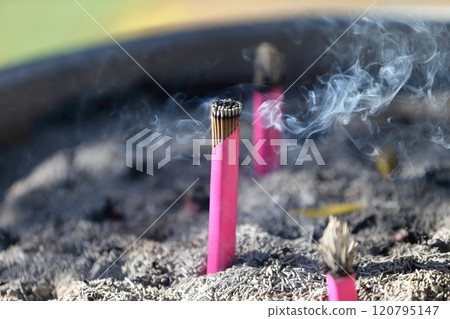 A bundle of incense sticks in a regular incense burner A bundle of incense sticks in a regular incense burner 120795147