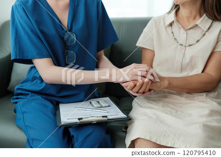 A woman in a white dress is being comforted by a woman in a blue uniform A woman in a white dress is being comforted by a woman in a blue uniform 120795410