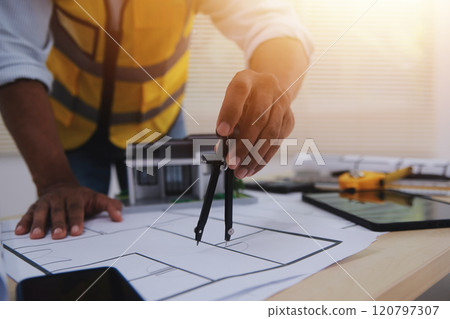 Image of engineer meeting for architectural project. working with partner and engineering tools on workplace vintage tone. Image of engineer meeting for architectural project. working with partner and engineering tools on workplace vintage tone. 120797307