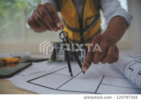 Image of engineer meeting for architectural project. working with partner and engineering tools on workplace vintage tone. Image of engineer meeting for architectural project. working with partner and engineering tools on workplace vintage tone. 120797308