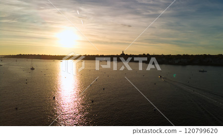 Sunset sea and ships in an American port town Sunset sea and ships in an American port town 120799620