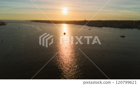 Sunset and ships in an American port town Sunset and ships in an American port town 120799621