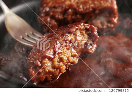 Juicy hamburger steak cooked on a hot iron plate, steaming hot 120799815