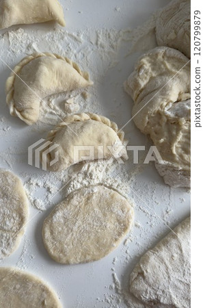 Homemade Dough Preparation for Traditional Ukrainian Dumplings in Kitchen 120799879