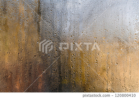 Water drops on wet glass 120800410