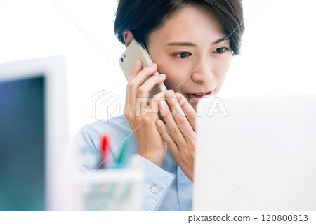 Business woman calling with a smartphone Business woman calling with a smartphone 120800813