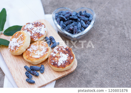 honeysuckle berries on a concrete background. 120801876