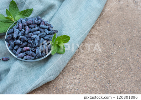 honeysuckle berries on a concrete background. honeysuckle berries on a concrete background. 120801896