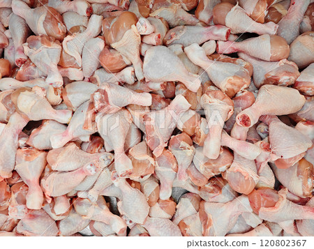 Fresh Raw Chicken Drumsticks Piled in a Market Display Fresh Raw Chicken Drumsticks Piled in a Market Display 120802367