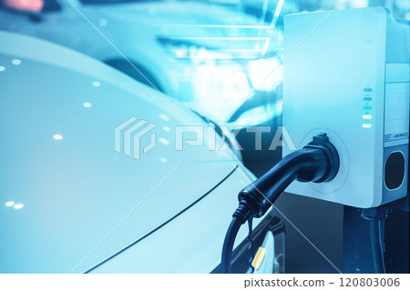 Car charging at electric car charging station. Electric vehicle charger station for charge EV battery. Charging point at car parking lot. Clean and sustainable energy. Commercial EV charging point. 120803006