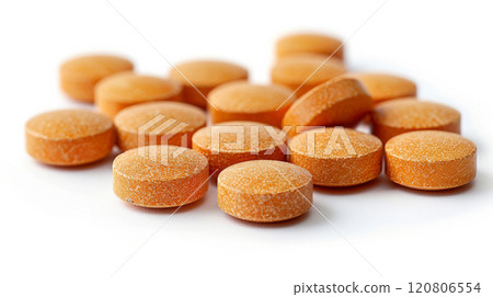 Group of orange speckled round tablets on white background, vibrant pharmaceutical design for healthcare and medication concept Group of orange speckled round tablets on white background, vibrant pharmaceutical design for healthcare and medication concept 120806554