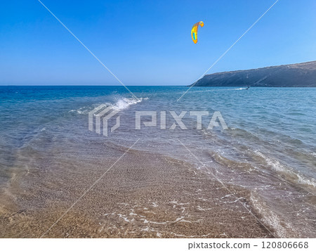 Kitesurfing adventure in clear waters on a sunny coastal day. High quality photo Kitesurfing adventure in clear waters on a sunny coastal day. High quality photo 120806668
