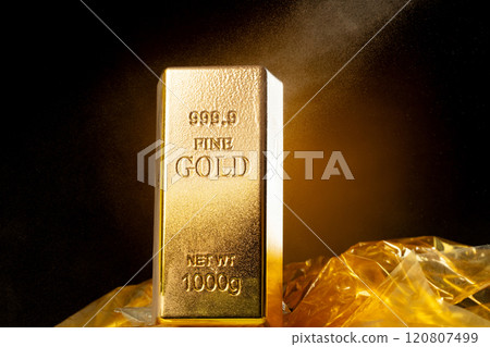 Melting Gold Bar Flowing into Liquid spray wealth prosperity. Gold bar standard is bank reserve to finance economic, golden liquid water splash as price up down. Black background isolated 120807499