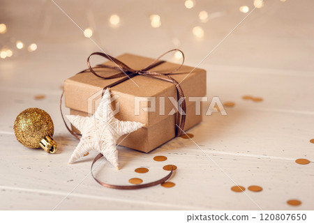 Christmas gift box and decorations on white wooden table. Christmas gift box and decorations on white wooden table. 120807650