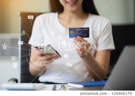 Female businessman use credit cards to conduct financial transactions through phones, tablet, and laptop. Female businessman use credit cards to conduct financial transactions through phones, tablet, and laptop. 120808179