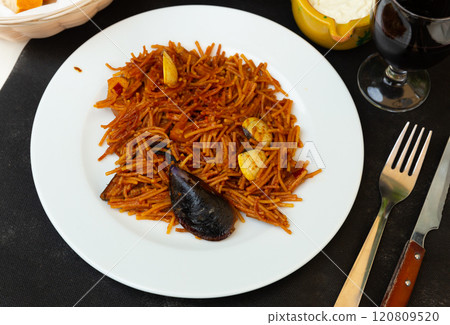 Paella with fideua, pasta noodles and seafood 120809520